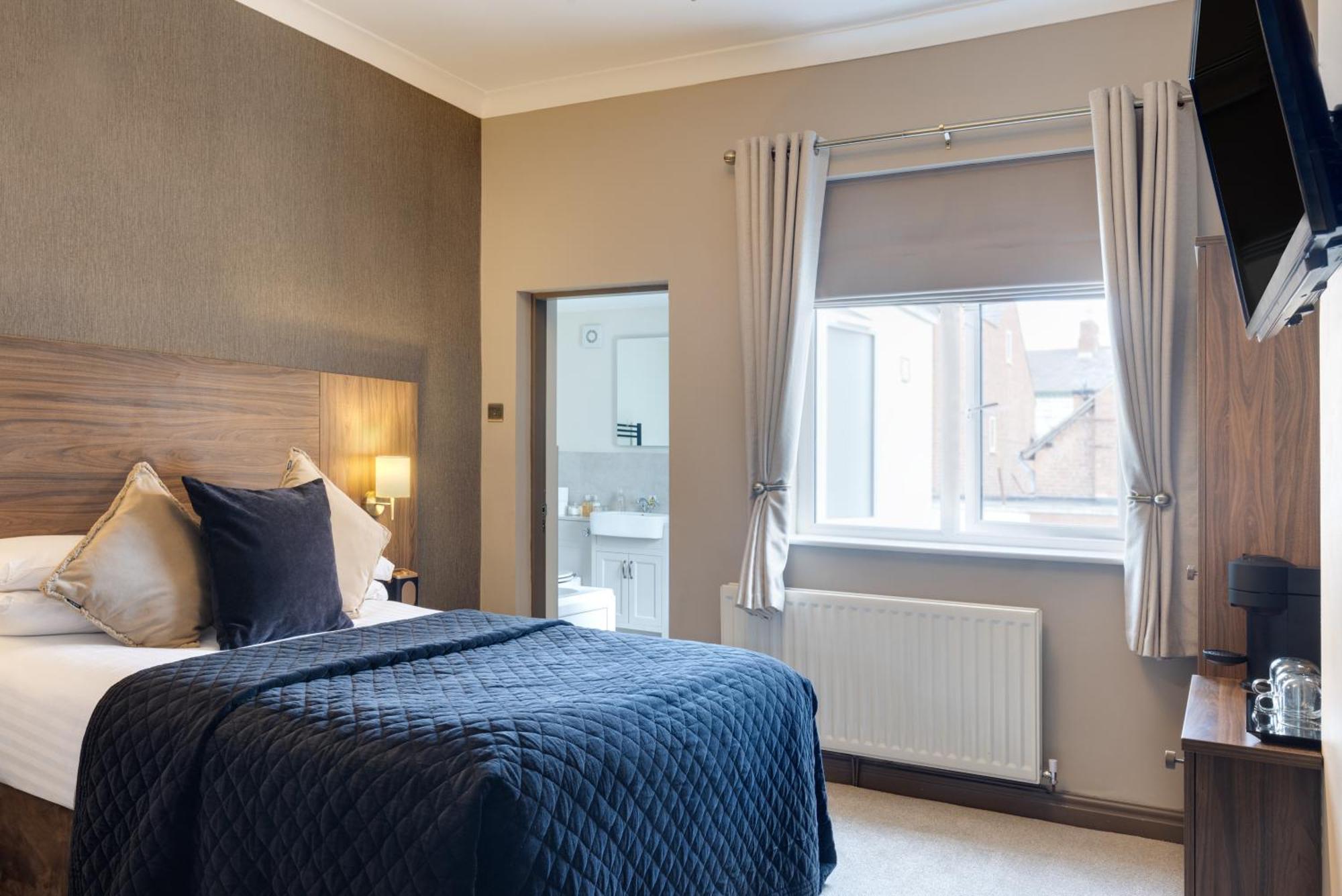 Stone Villa Chester Camera foto A bedroom at the hotel
