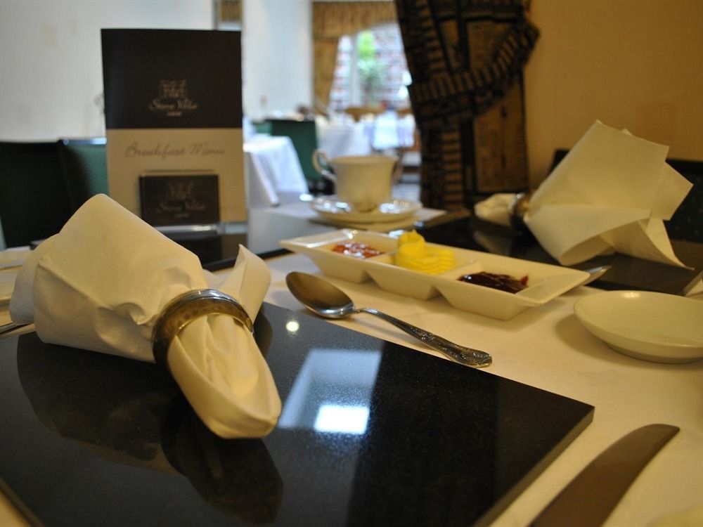 Stone Villa Chester Esterno foto A table set for afternoon tea at the Taj Mahal Palace, Mumbai, India
